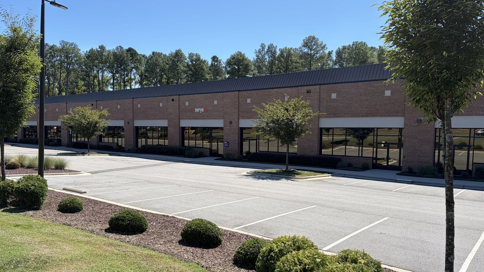 Exterior of the Surya Technologies facility at 1 TW Alexander Drive, Research Triangle Park, North Carolina